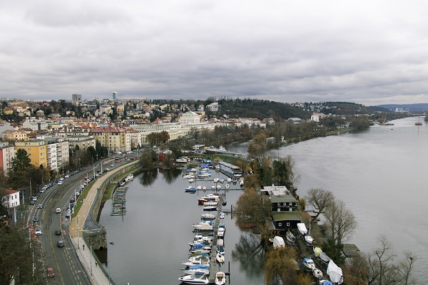 Boats docked in a port along a river